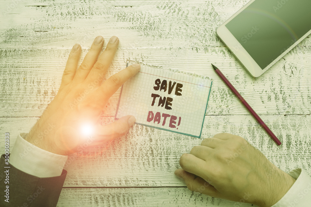 Obraz premium Conceptual hand writing showing Save The Date. Concept meaning Organizing events well make day special event organizers Hand hold note paper near writing equipment and smartphone