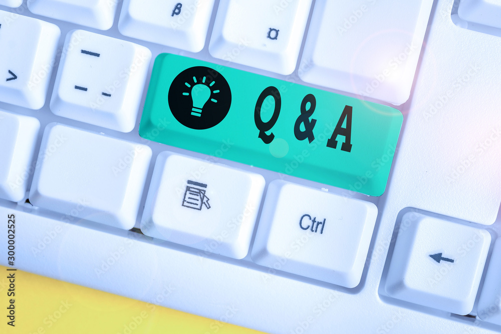 Handwriting text writing Q And A. Conceptual photo defined as questions being asked and answers White pc keyboard with empty note paper above white background key copy space Handwriting text writing Q And A. Conceptual photo defined as questions being asked and answers White pc keyboard with empty note paper above white background key copy space