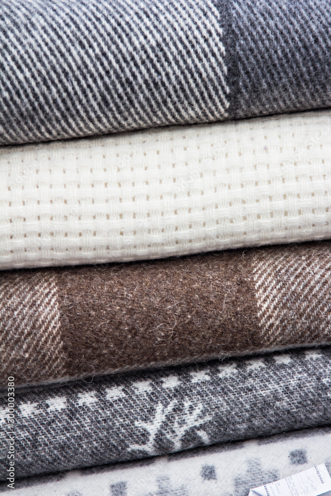 A pile of warm wool scarves. winter comfort, winter inspiration, still life A pile of warm wool scarves. winter comfort, winter inspiration, still life