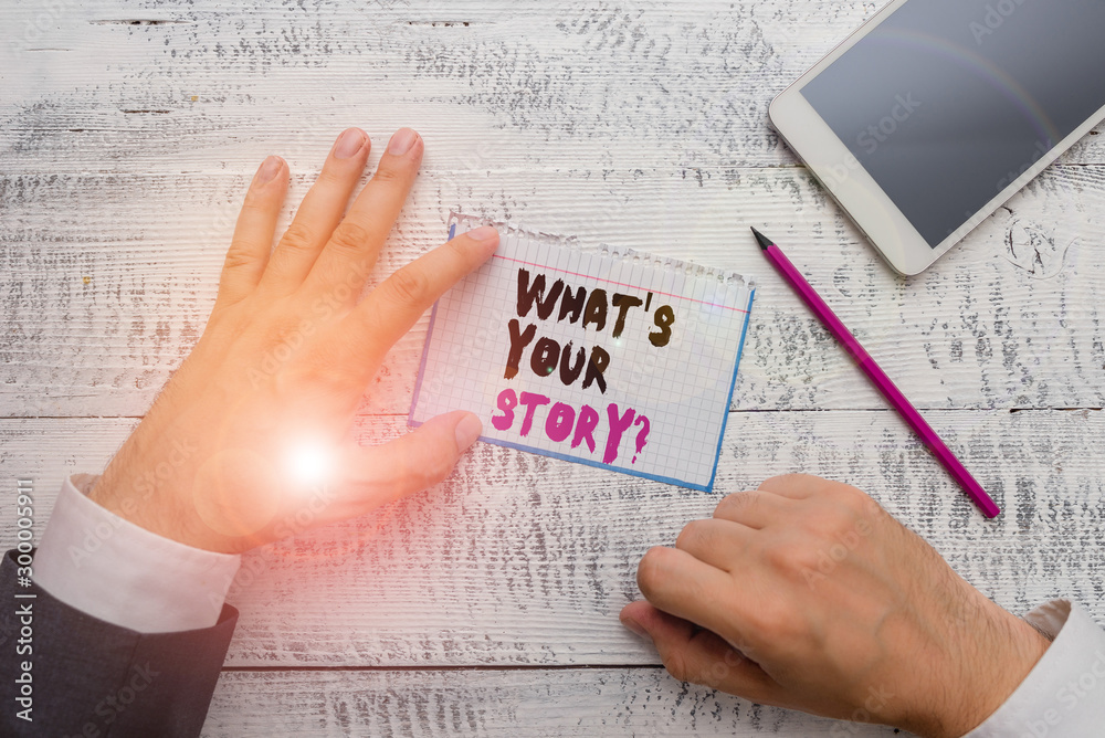 Fototapeta premium Conceptual hand writing showing What S Is Your Story question. Concept meaning being asked by someone about my own journey from beginning till now Hand hold note paper near writing equipment and