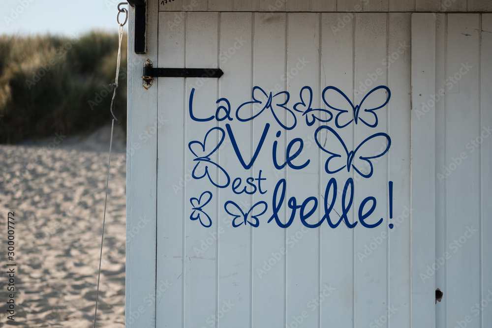 Strandhütte mit Spruch "Das Leben ist schön" Stock Photo Adobe Stock