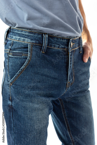 man in jeans, denim pants close up on white background, blue jeans, blue t-shirt