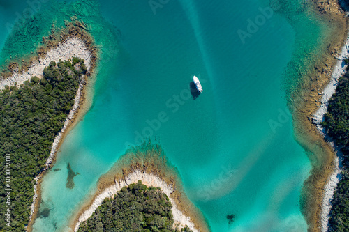 Aerial view of sea and beach in a lagoon on Cres ( isola Cherso ) Island Croatia, close to Punta Kriza ( Punta Croce ). It is a part of national where rocks and sand and forest merge on a coast. 