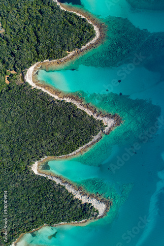 Aerial view of sea and beach in a lagoon on Cres ( isola Cherso ) Island Croatia, close to Punta Kriza ( Punta Croce ). It is a part of national where rocks and sand and forest merge on a coast. 