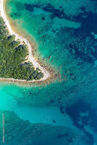 Aerial view of sea and beach in a lagoon on Cres ( isola Cherso ) Island Croatia, close to Punta Kriza ( Punta Croce ). It is a part of national where rocks and sand and forest merge on a coast. 