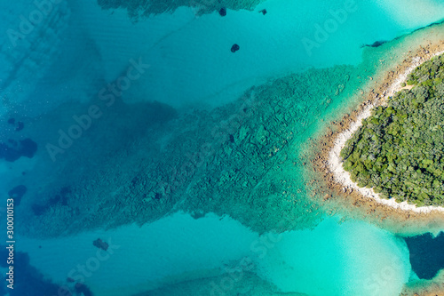 Aerial view of sea and beach in a lagoon on Cres ( isola Cherso ) Island Croatia, close to Punta Kriza ( Punta Croce ). It is a part of national where rocks and sand and forest merge on a coast. 