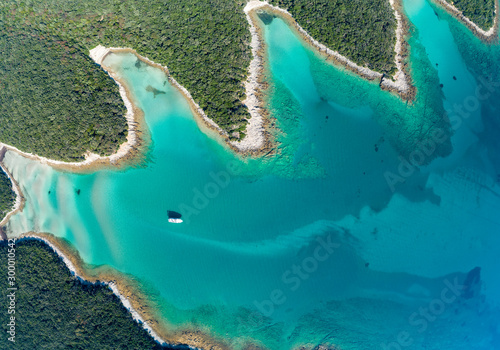 Aerial view of sea and beach in a lagoon on Cres ( isola Cherso )  Island Croatia, close to Punta Kriza ( Punta Croce ). It is a part of national where rocks and sand and forest merge on a coast.  photo