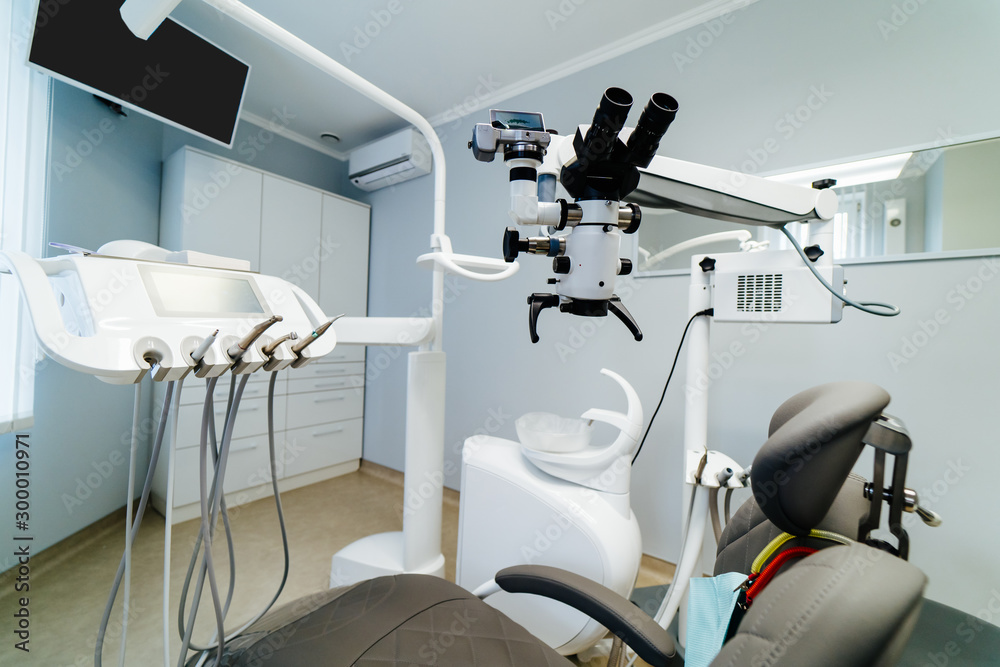 Brand new medical office. Dentist room. Stomatologist professional  equipment. Hi tech medical clinic. Dentist clinic. Modern dental office  interior. Advanced Microscope for teeth treatment. Stock Photo | Adobe Stock