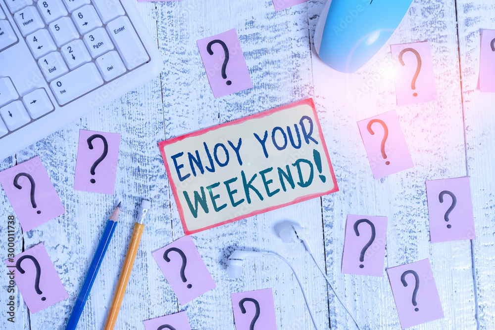 Handwriting text writing Enjoy Your Weekend. Conceptual photo wishing someone that something nice will happen at holiday Writing tools, computer stuff and scribbled paper on top of wooden table Handwriting text writing Enjoy Your Weekend. Conceptual photo wishing someone that something nice will happen at holiday Writing tools, computer stuff and scribbled paper on top of wooden table