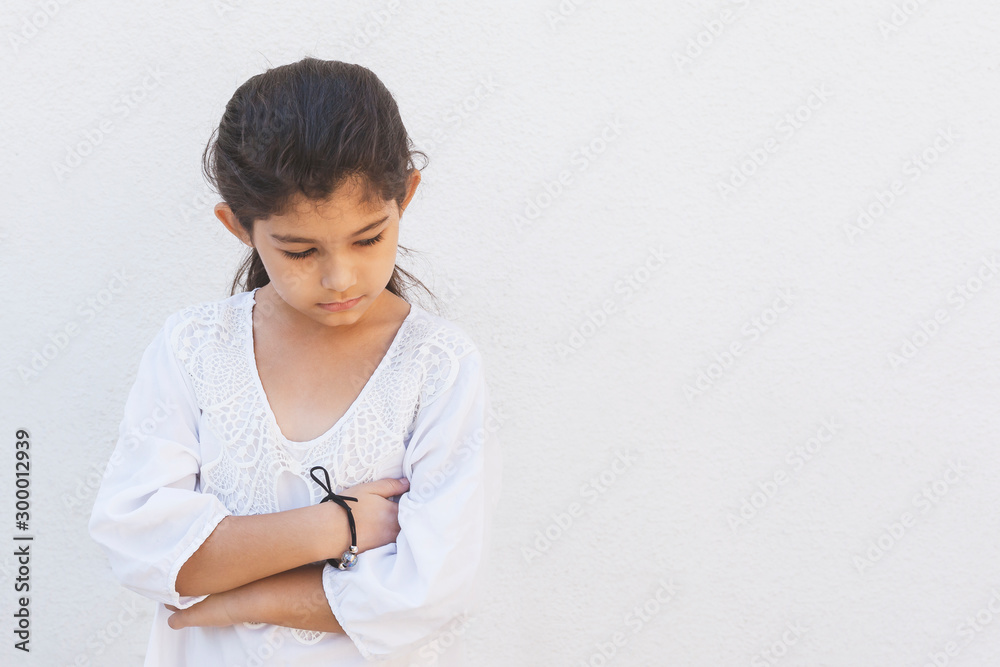 A little girl in a bad mood. Resentment, upset, sad, offended kid reactions, expressing disagreement A little girl in a bad mood. Resentment, upset, sad, offended kid reactions, expressing disagreement