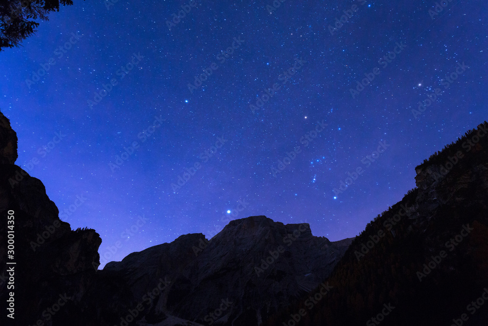 Night sky with stars at Dolomites mountains, Italy