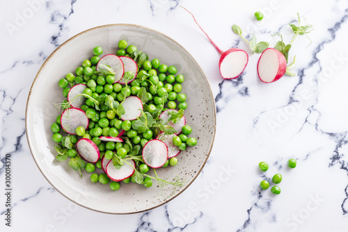 fresh salad with radishes and peas for spring menu