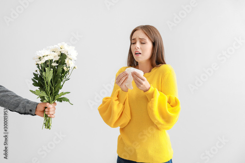 Man giving flowers to young...