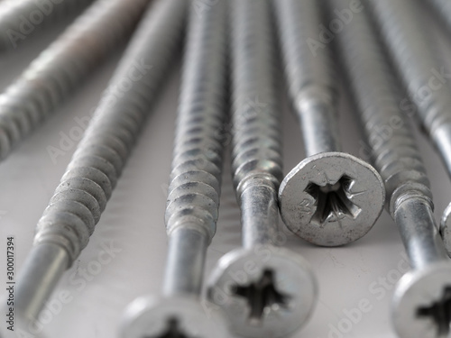 cross headed screws and rawl plugs on a clean background photo