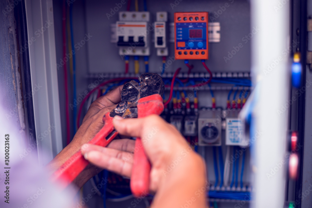 The electrician connected the electrical wires in the electrical