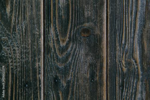 Dark brown wood texture background. Wooden boards with nails