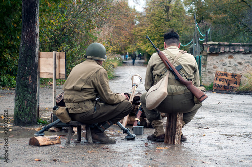 Mulhouse - France - 2 November 2019 - Portrait of american soldiers and machone gun during the world war two reconstitution for the 75 th anniversary of the liberation of Alsace in France