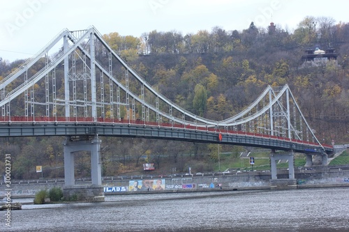 Autumn landscape: bridge over the river in Kyiv, Ukraine. Trukhanov Island