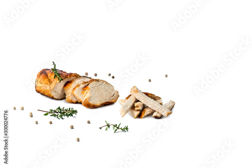 Food composition, Grilled chicken breast, meat cut into small pieces with thyme and black pepper isolated on white background