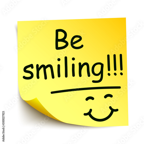 Yellow sticker with black postit „Be smiling!!!“, note hand written - stock vector