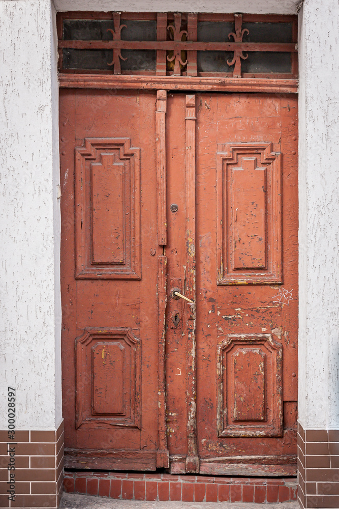 Old wooden weathered brown front door