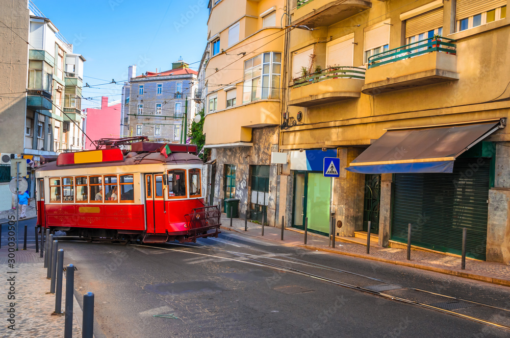 Obraz premium Famous vintage tram in the street of Alfama, Lisbon, Portugal