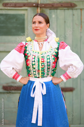 Young beautiful slovak woman in traditional costume photo