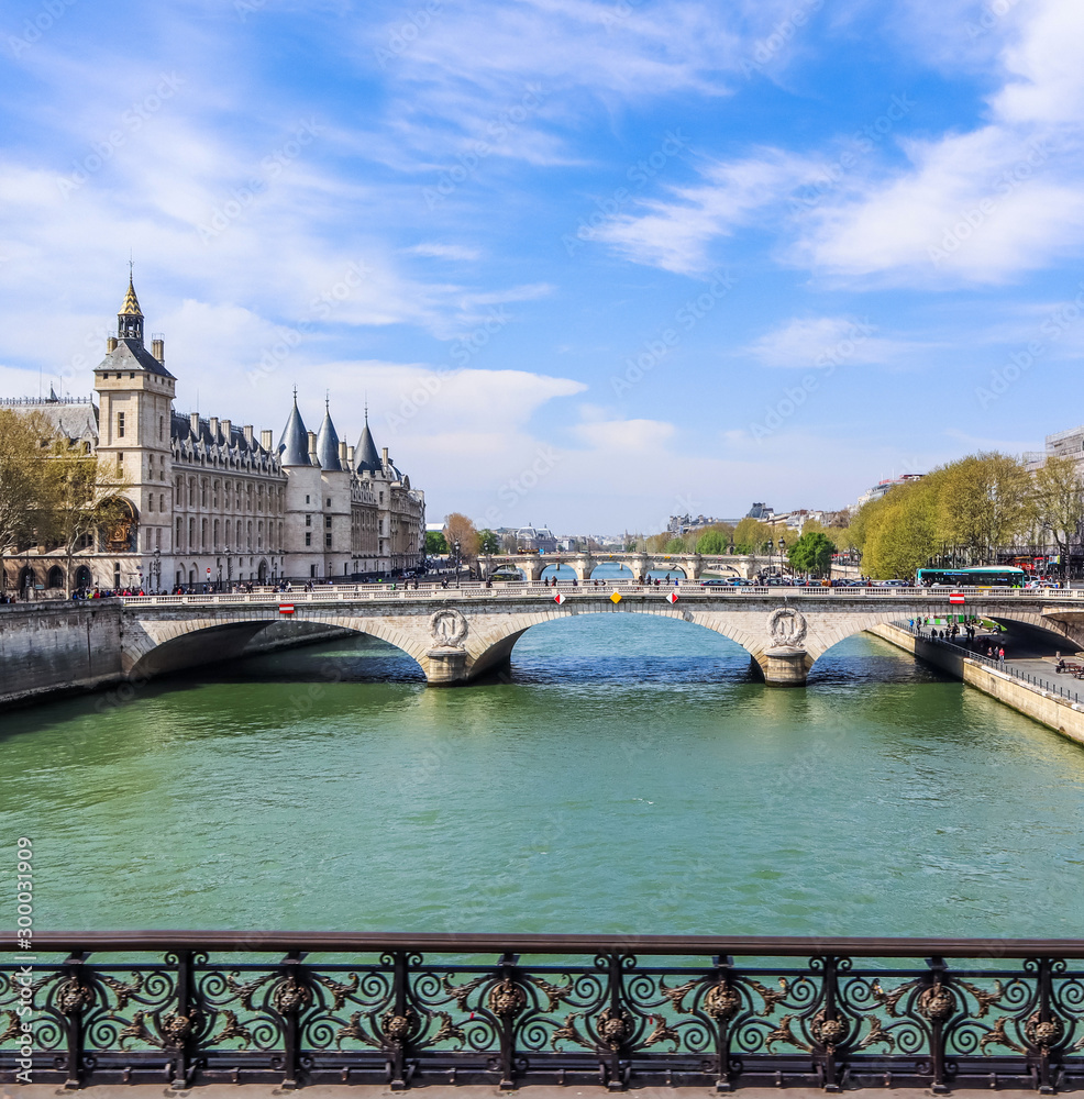Beautiful cityscape of Paris and Saint-Michel bridge across Seine river. France. April 2019