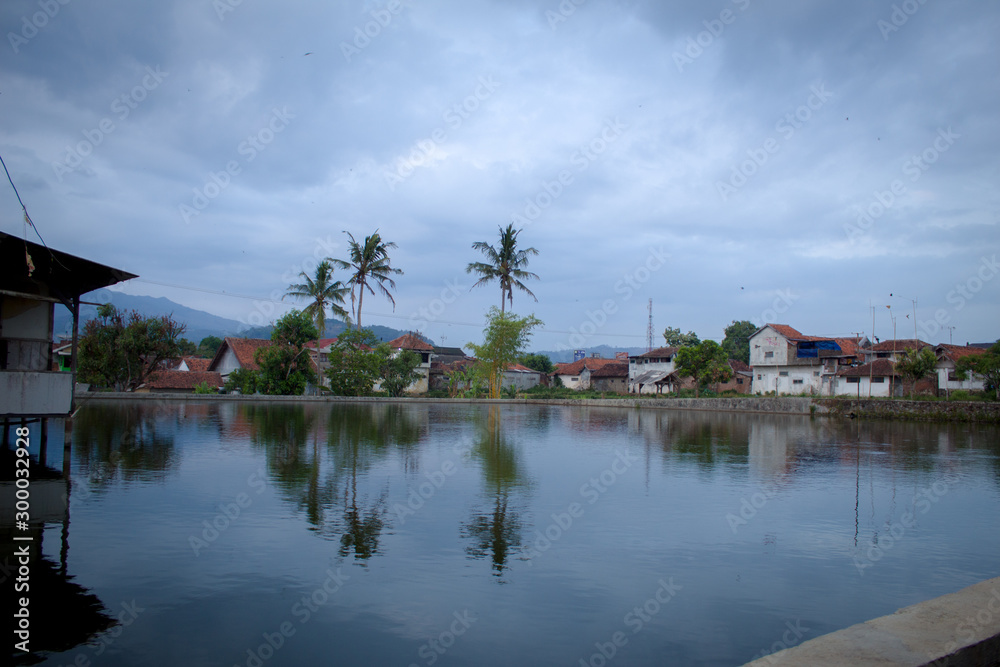 Beautiful clouds and blue sky view reflected in water 