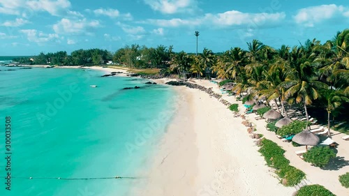 Aerial drone view of Belle Mare paradise coast and beach on tropical island of Mauritius. Toned footage.