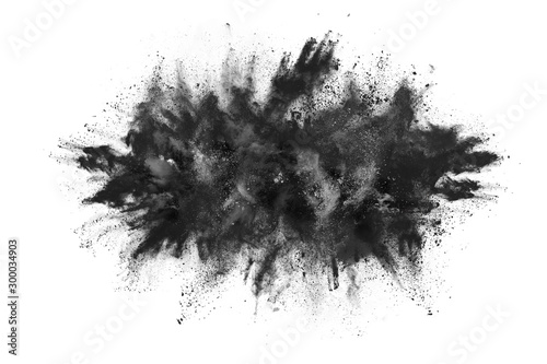 Valokuvatapetti Black powder explosion white background.