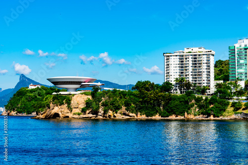 The beauty of an urban landscape with one of Oscar Niemeyer's works, the Museum of Contemporary Art (MAC). Photo taken in Niteroi, Rio de Janeiro, Brazil. photo