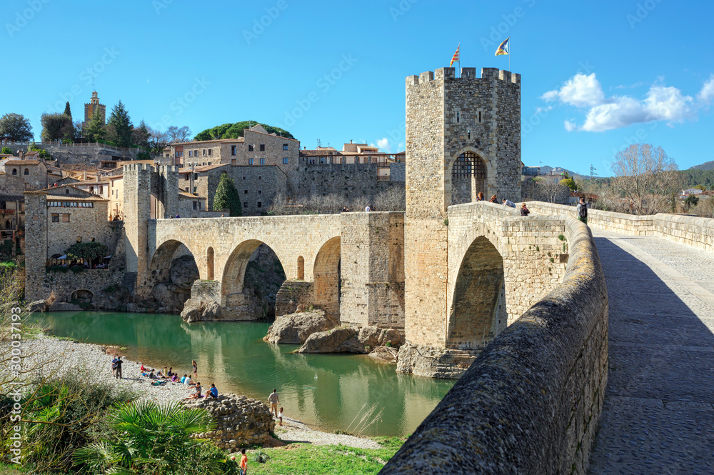Old bridge over the river Fluvia in medieval town of Besalu, province Girona, Spain.