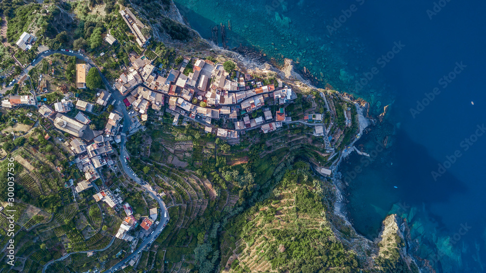Overhead aerial view of Corniglia on the montain in the morning sunshine in Cinque Terre, Italy