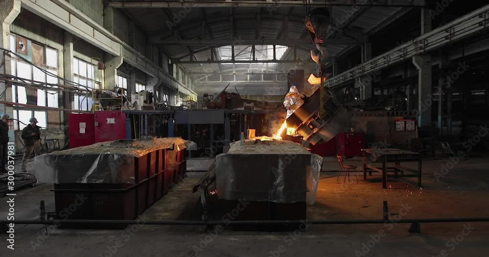 Hard work in the foundry. Pouring molten steel. Liquid steel pouring. Molten metal pouring, metallurgy, steel casting foundry. Steel manufacturing Hard work in the foundry. Pouring molten steel. Liquid steel pouring. Molten metal pouring, metallurgy, steel casting foundry. Steel manufacturing
