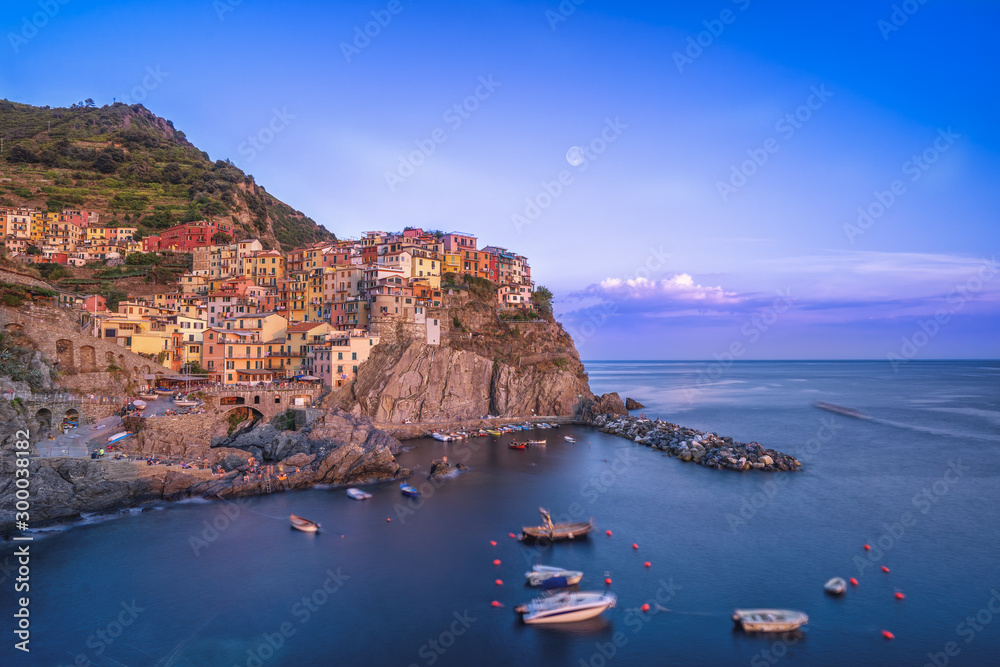 Long exposure shot of Manarola in Cinque Terre, Italy during sunset hours