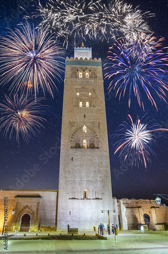 Koutoubia Mosque minaret in old medina with fireworks in Marrakesh, Morocco photo