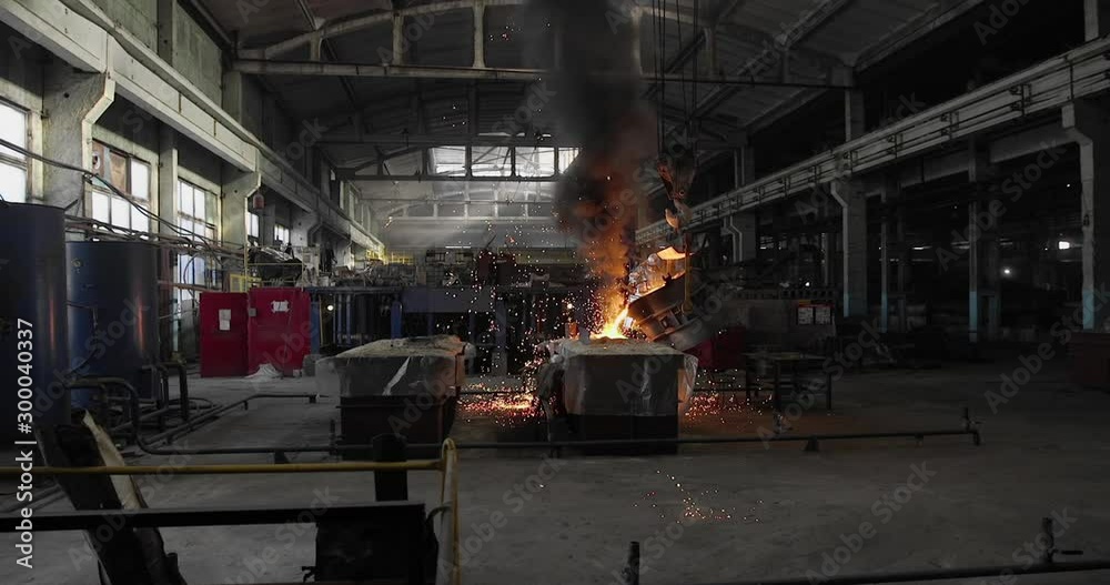 Hard work in the foundry. Pouring molten steel. Liquid steel pouring. Molten metal pouring, metallurgy, steel casting foundry. Steel manufacturing Hard work in the foundry. Pouring molten steel. Liquid steel pouring. Molten metal pouring, metallurgy, steel casting foundry. Steel manufacturing