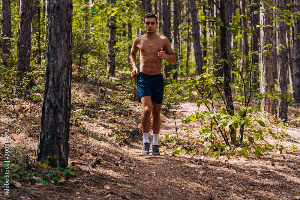 A skyrunner Caucasian athlete man trains in the high mountains A skyrunner Caucasian athlete man trains in the high mountains