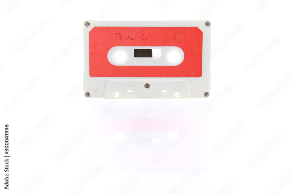 Audio cassette tape with reflection on a white background Audio cassette tape with reflection on a white background