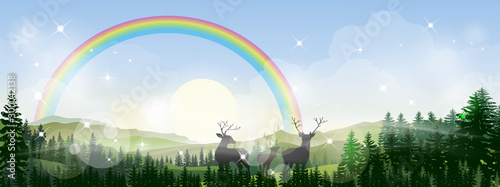 Panorama view of rainbow with morning light shining in forest foliage,Beautiful spring landscape with mystical forest pine tree fog with reindeer family, Scenery nature landscape of misty mountains