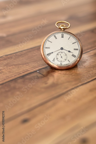 Wallpaper Mural Pocket watch on a wooden surface. Torontodigital.ca