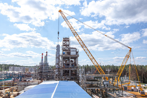 MOSCOW, RUSSIA, 08.2018: The construction of an oil refinery, near Moscow. industrial cranes (LIEBHERR), construction and installation of components of an oil refinery in near Moscow.