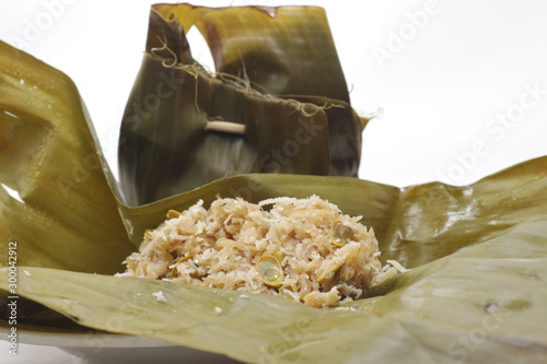 Botok, one of Indonesian food that made of grated coconut then wrapped with banana leafs photo