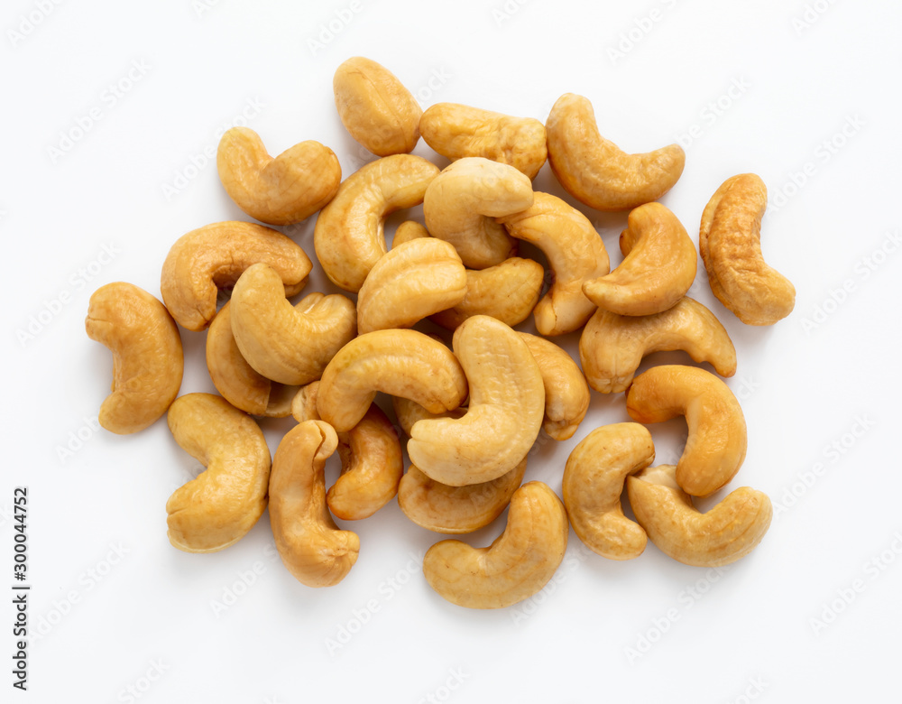 Cashews nuts isolated on white background close up. Cashews nuts isolated on white background close up.