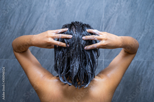 woman shower and wash hair in bathroom