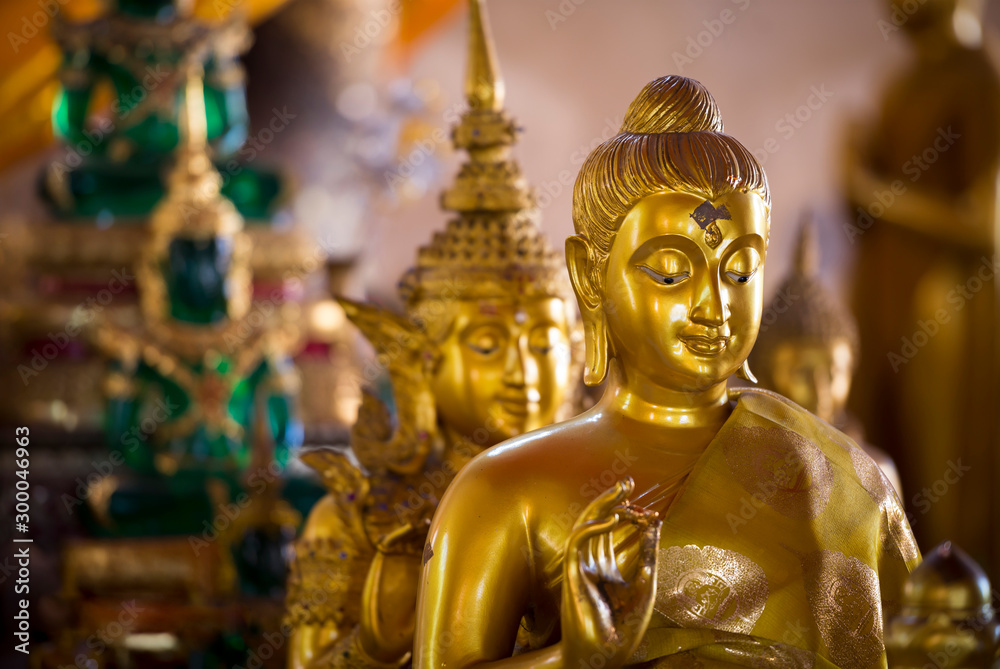 Row of Golden Buddha in Thailand. Golden Buddha statues at Temple of the Emerald Buddha