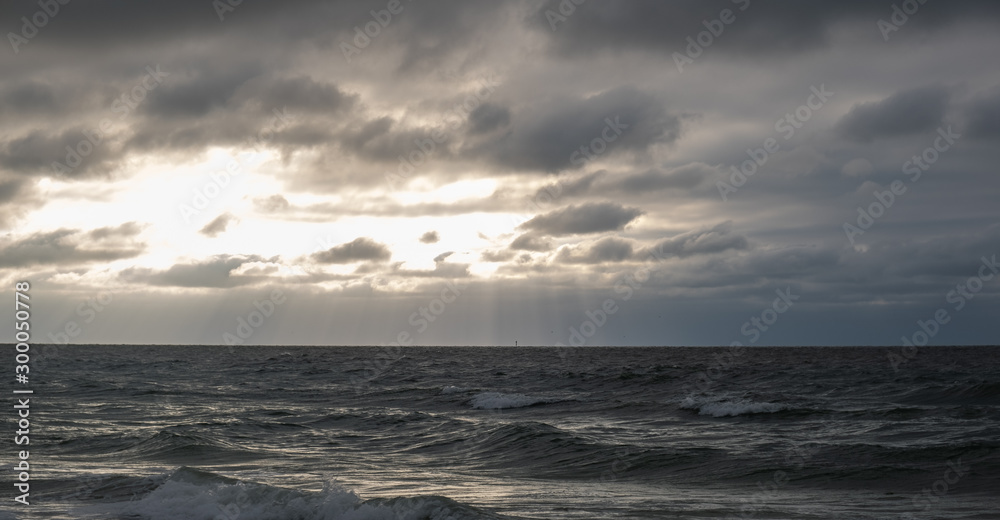 cloudy sunset with dark sea 