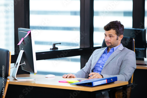 Frustrated stressed business man in an office