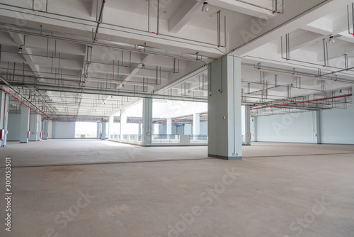 Large garage and factory building concrete building interior space view © bqmeng